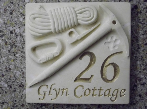 Climbing equipment plaque